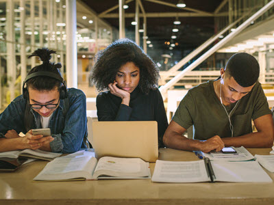 Three people studying