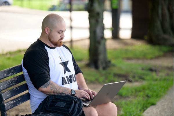 AMU student on laptop