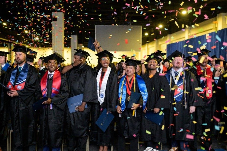 Graduates with confetti