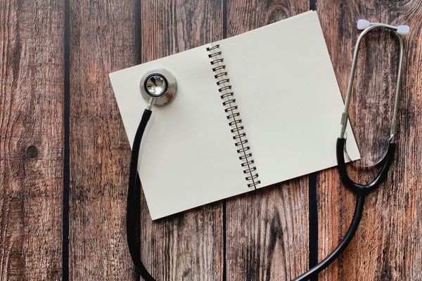 health science notebook with stethoscope