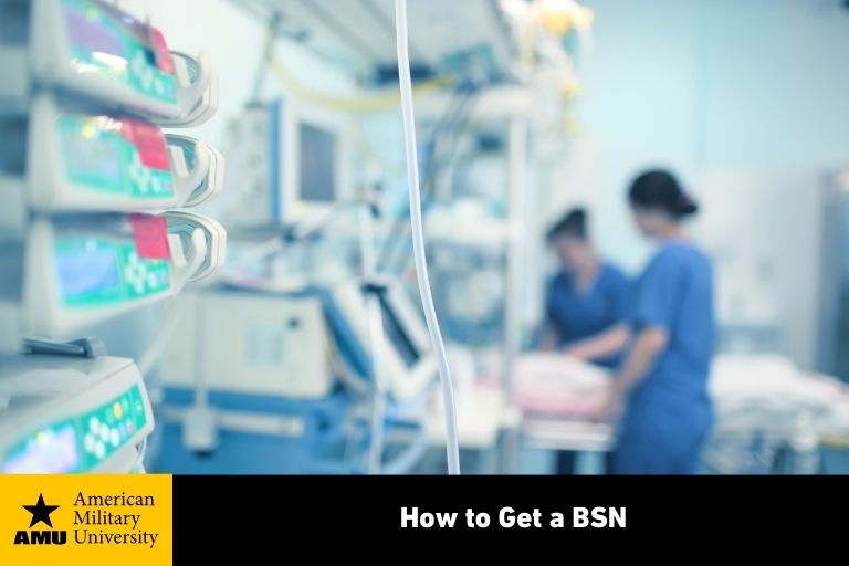 closeup of hospital monitors with nurses in the background