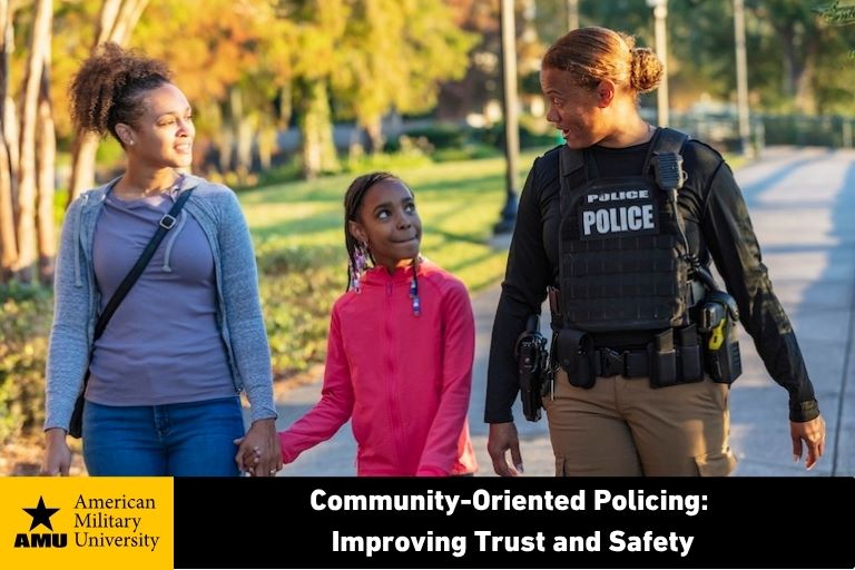 community oriented police officer walking with mother and child