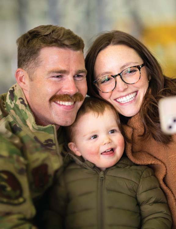 Family smiling for photo