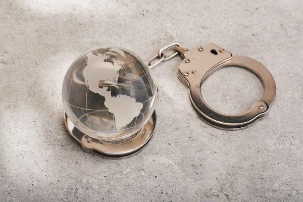 glass globe and handcuffs